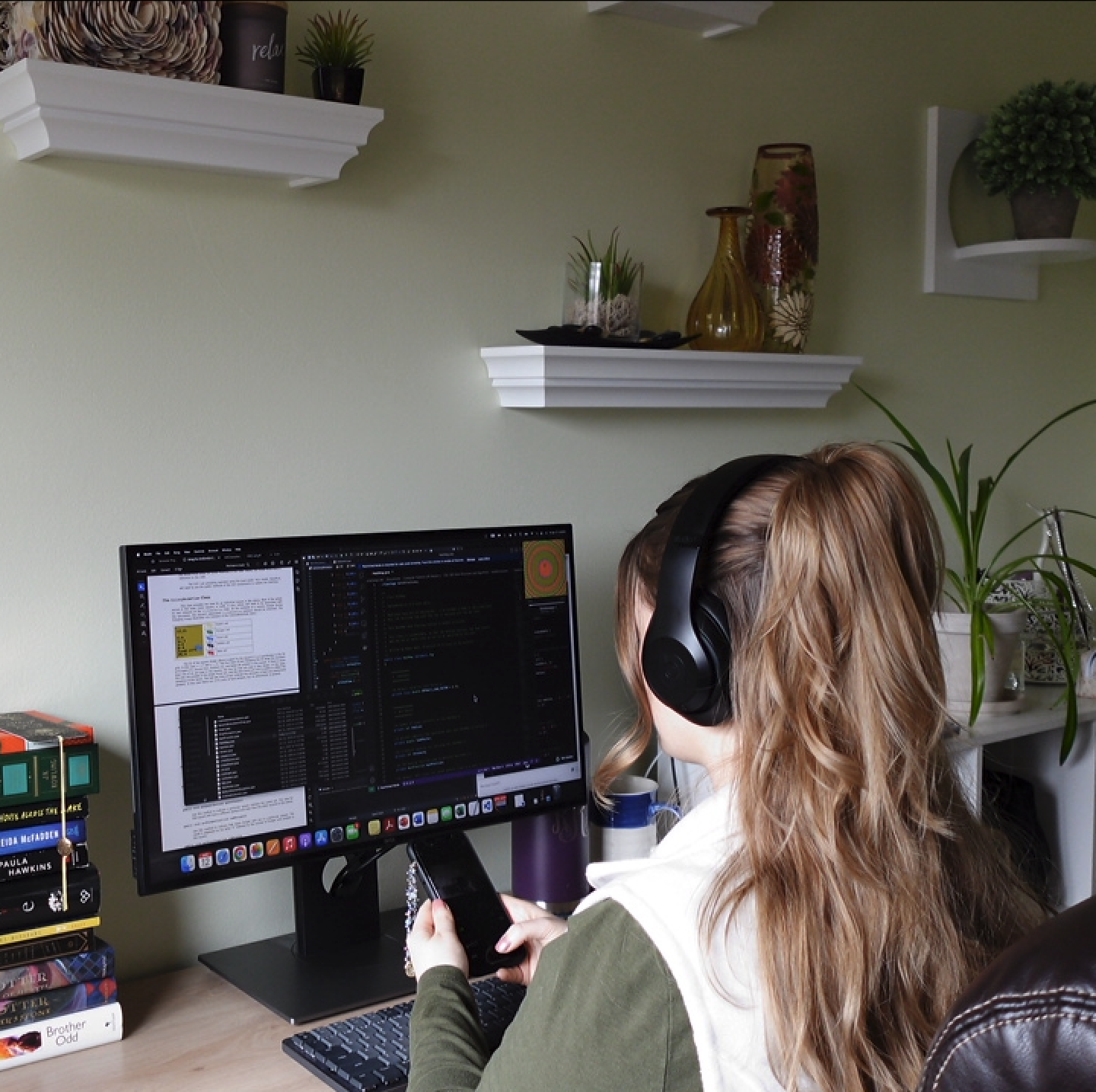 Photo of Rachel at desk connecting to socials